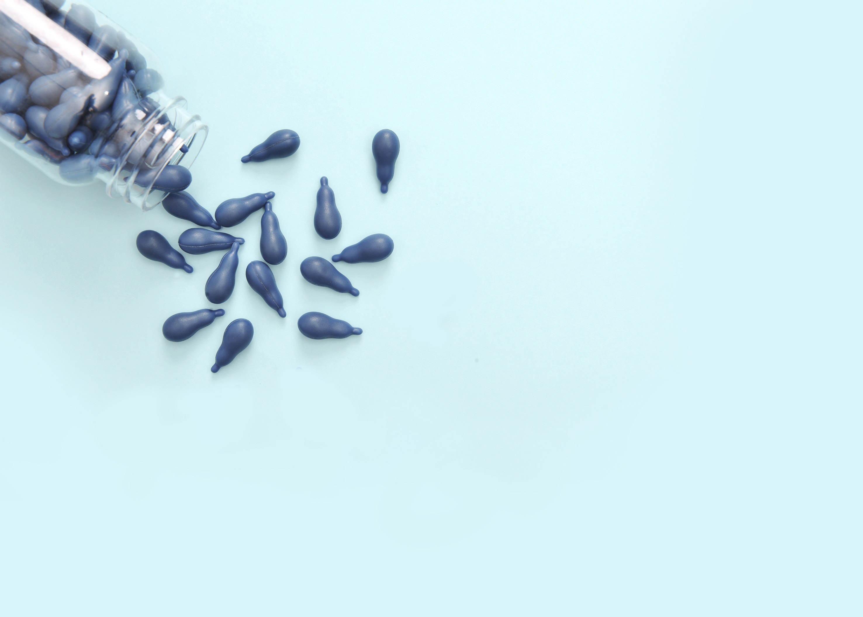 Blueberry and Lutein Esters Chewable Burstlet showing the ball fish and calabash shapes of the Chewable Burstlet format