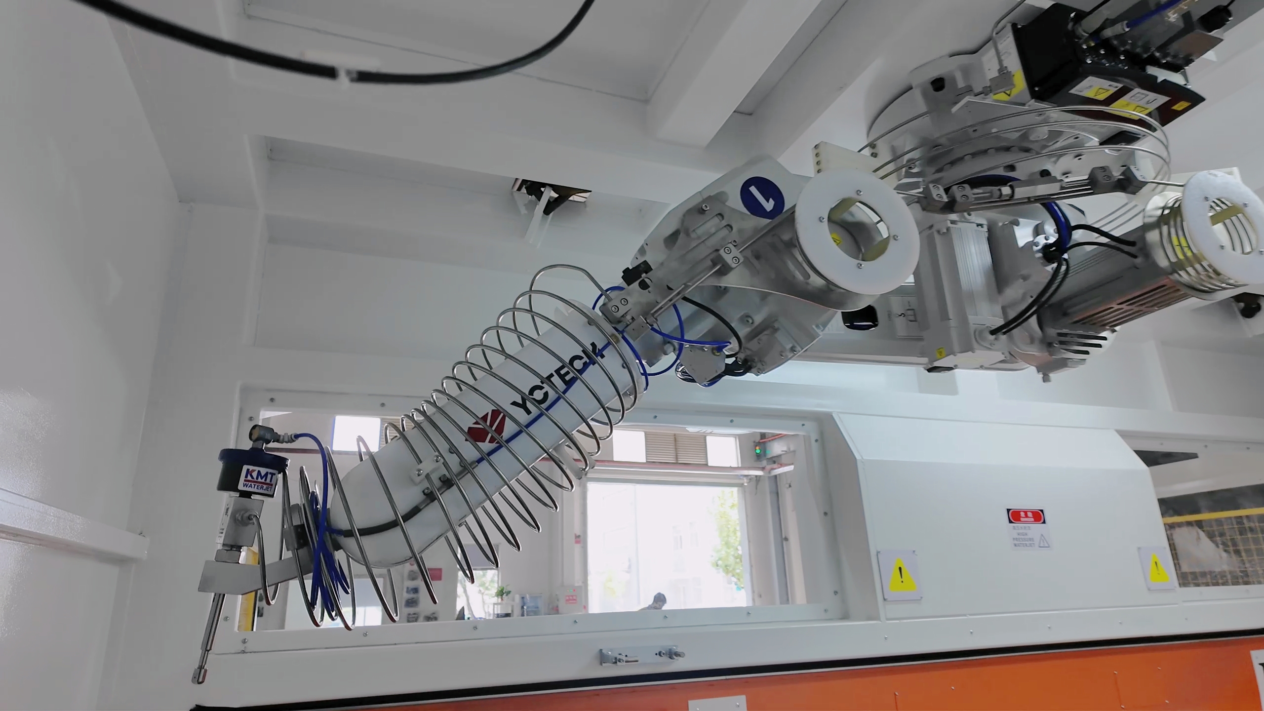 Robot waterjet system with 6-axis robotic arm cutting complex shape