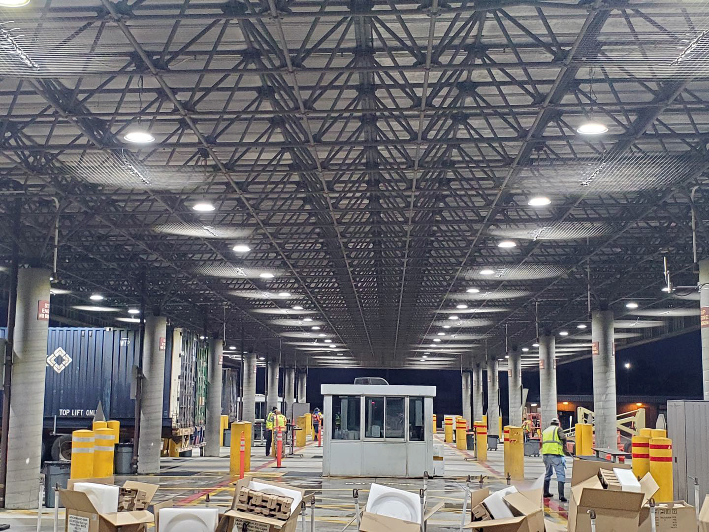 Railway station platform illuminated by LED outdoor lighting fixtures