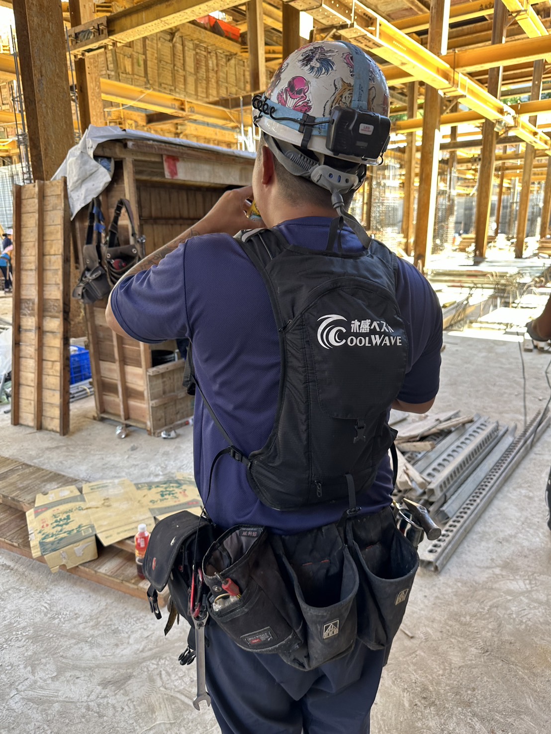 Construction worker wearing a cooling vest on site