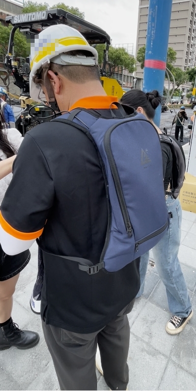 Construction site worker using cooling vest