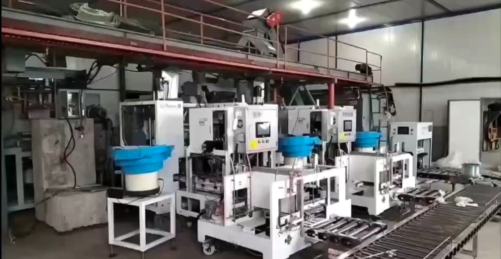 Edible mushroom bagging and inoculation production system in an indoor cultivation workshop