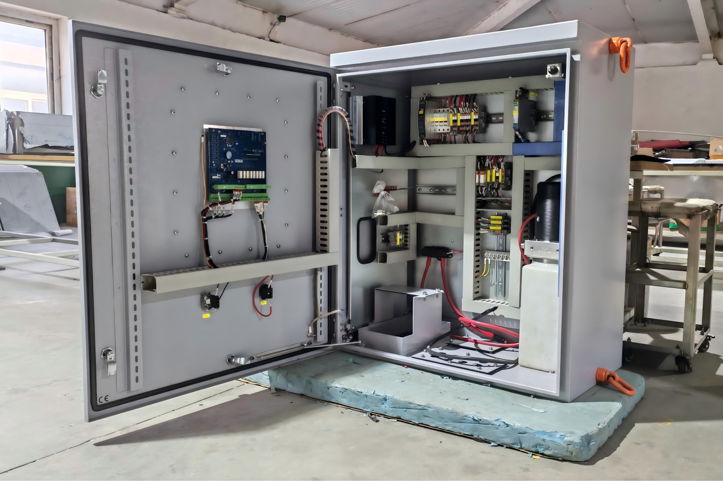 Internal view of IP55 control box with DIN rail and grounding bar