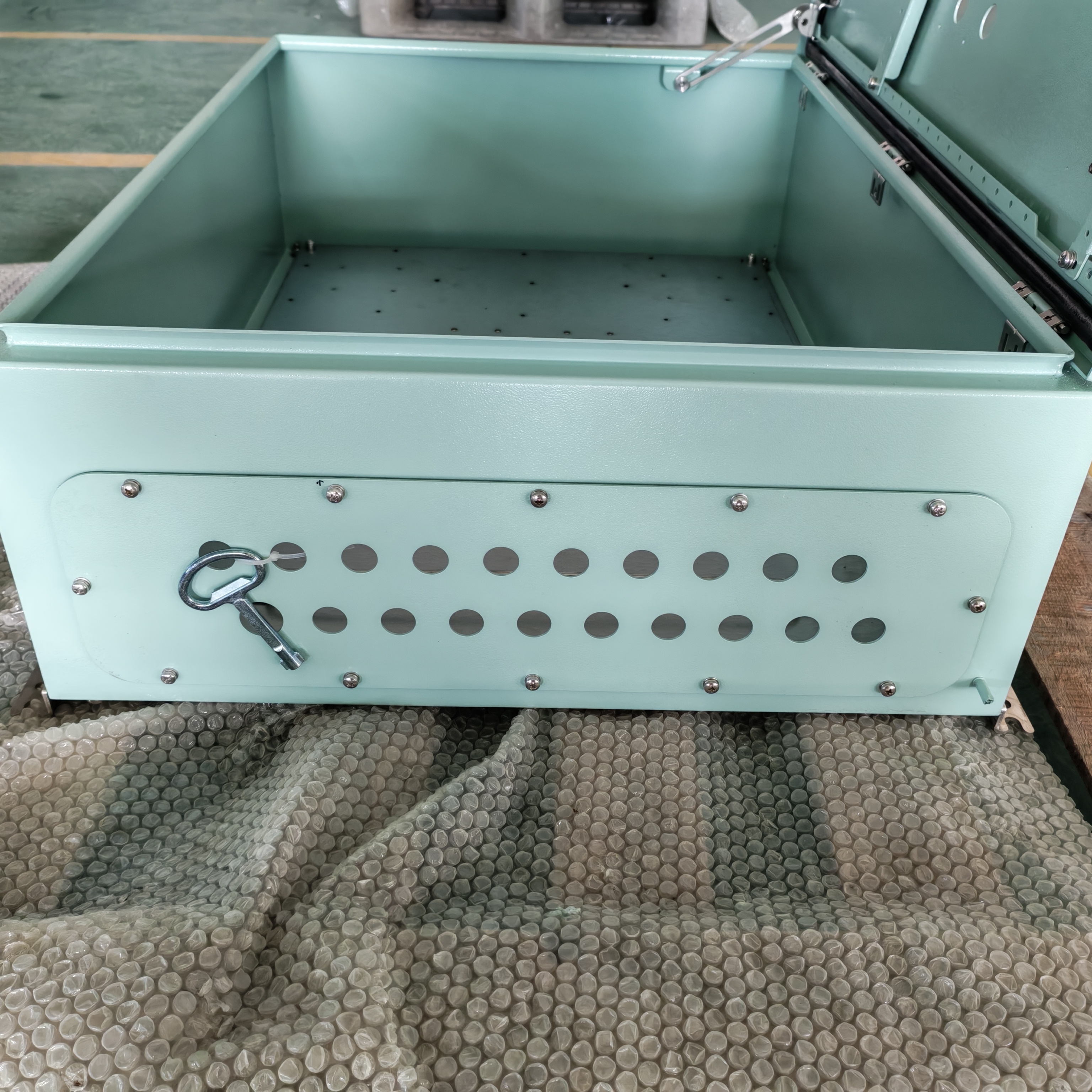 Wall-mounted electrical control box with EPDM door gasket and multi-size knockout cable entries for recessed or surface mounting