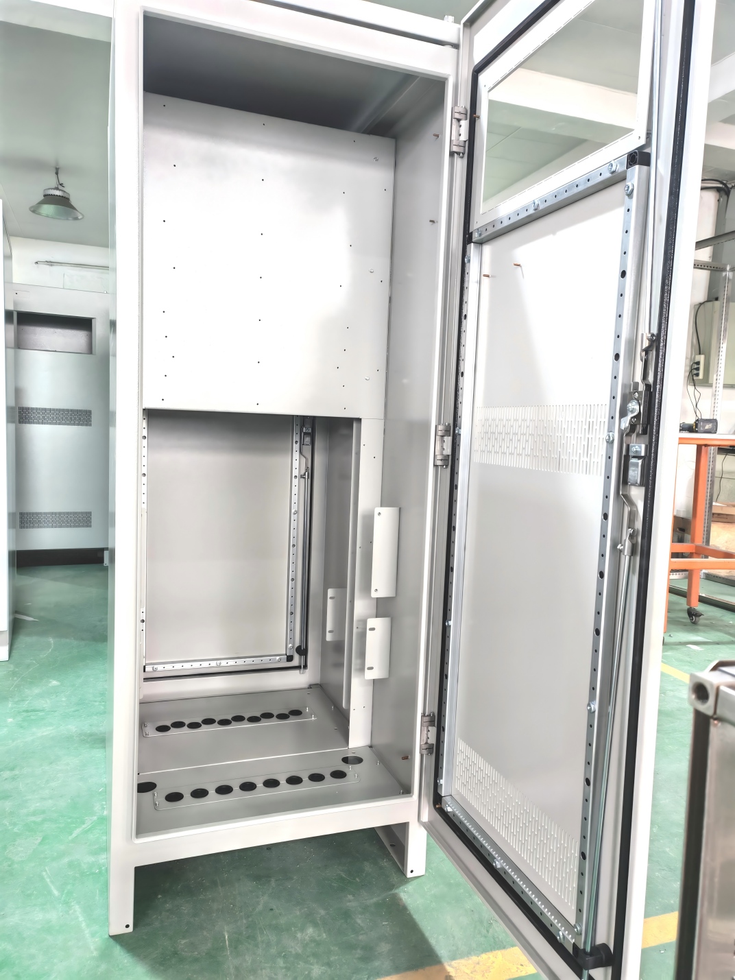 PLC enclosure with adjustable feet for floor mounting