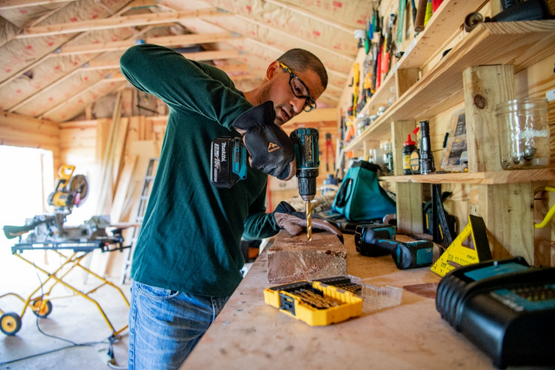 Carpentry and electrical work scene with cordless power tools