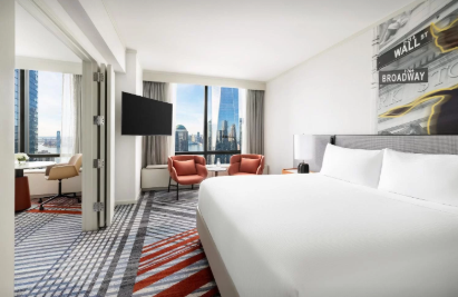 Guest room at Millennial Hotel USA showcasing custom hotel furniture from RICHART