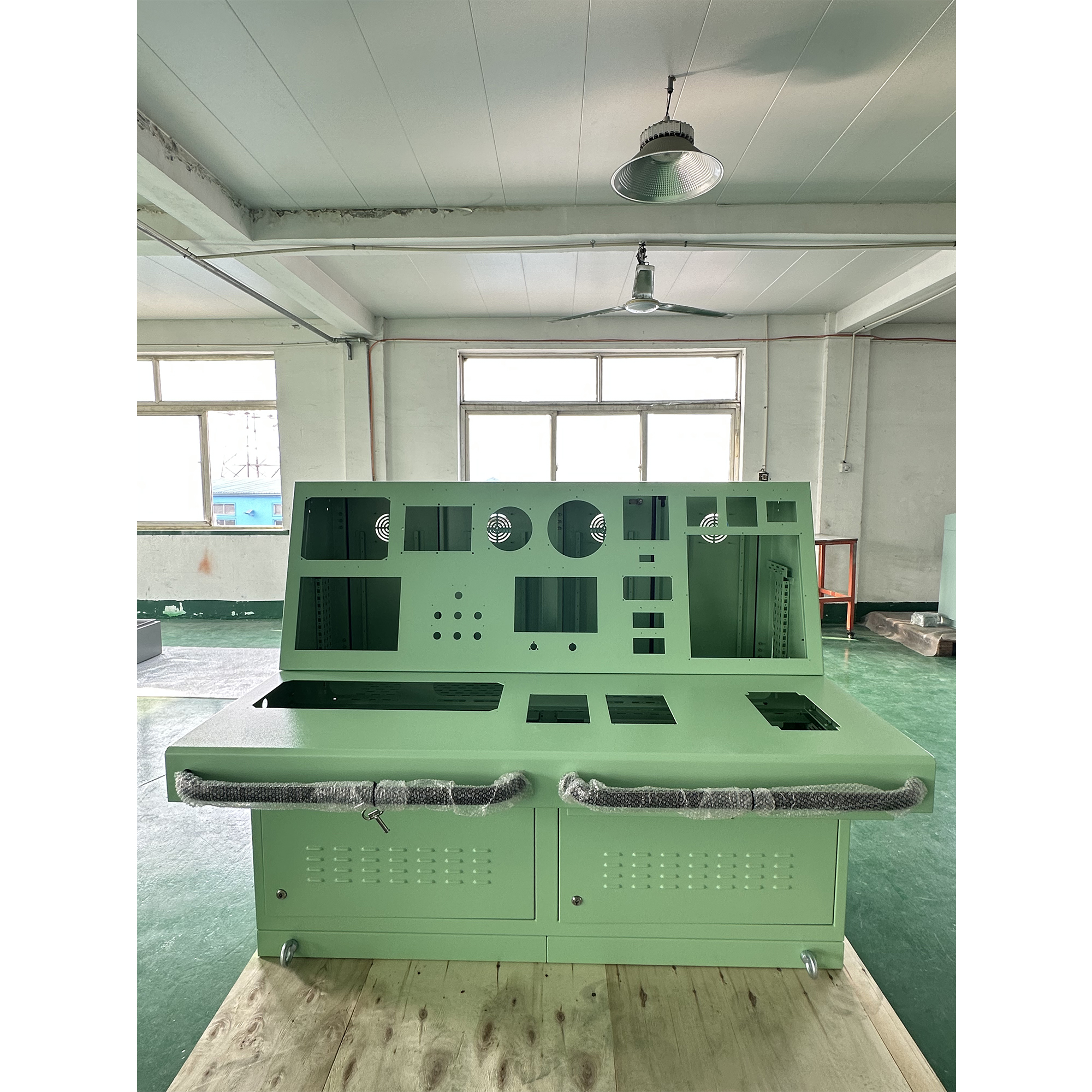 Sloped industrial control console with ergonomic operation area for displays and instruments