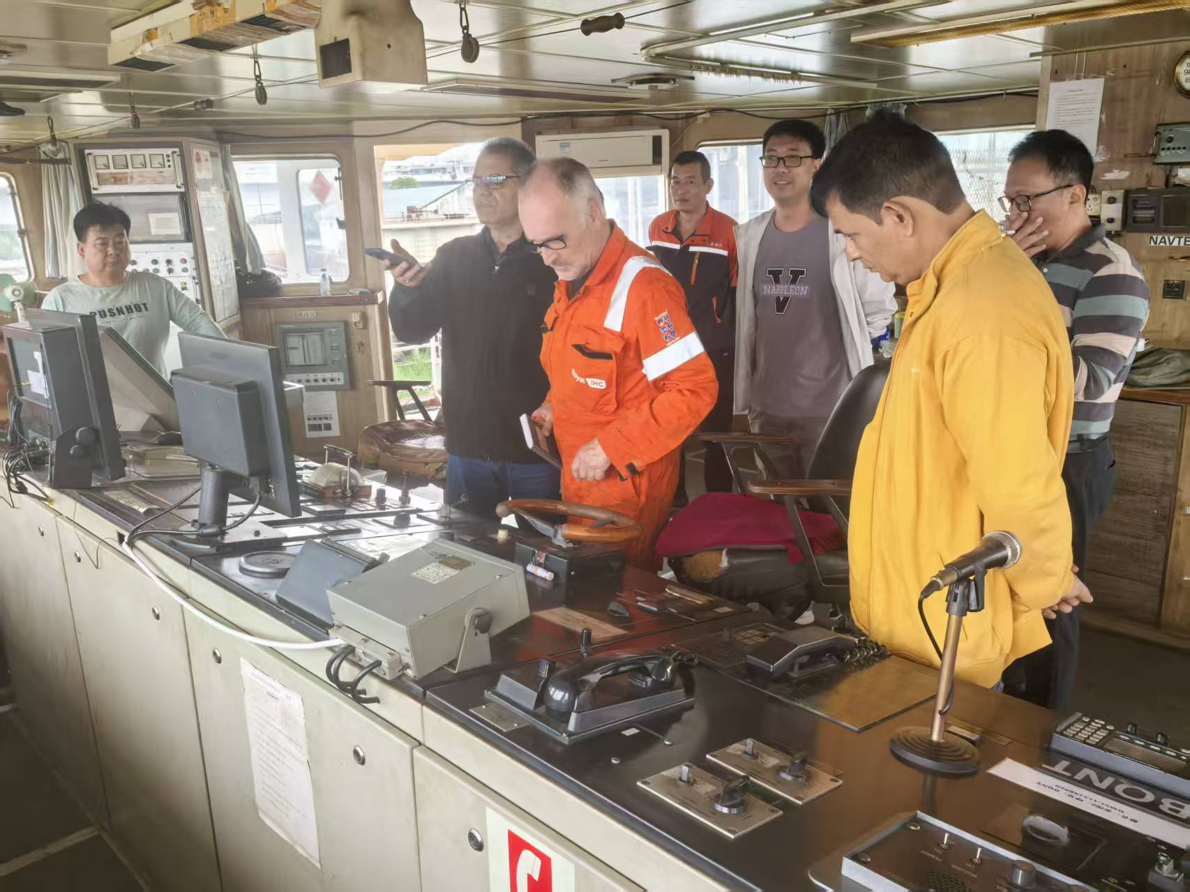 Dutch engineers performing equipment inspection on dredger