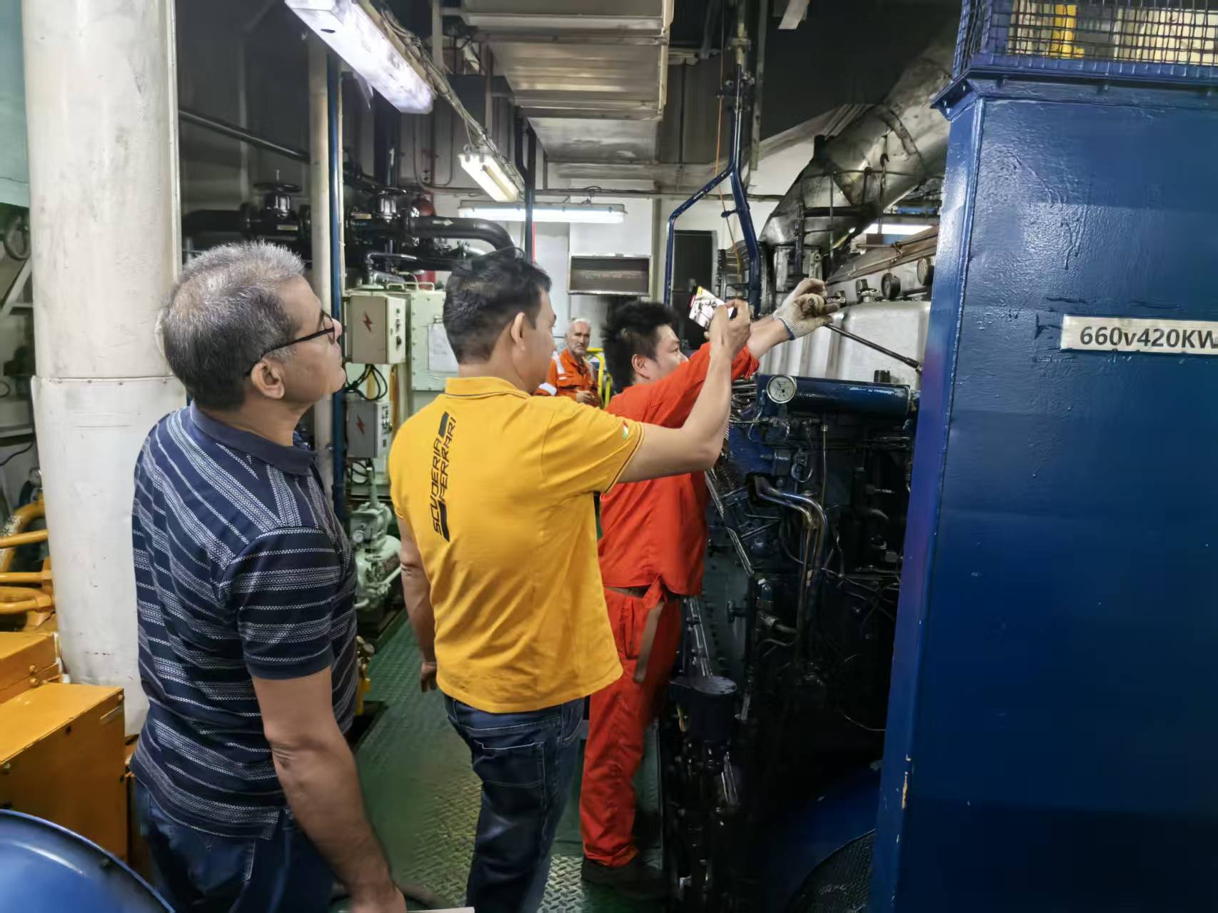 Engineer performing equipment inspection on a dredger