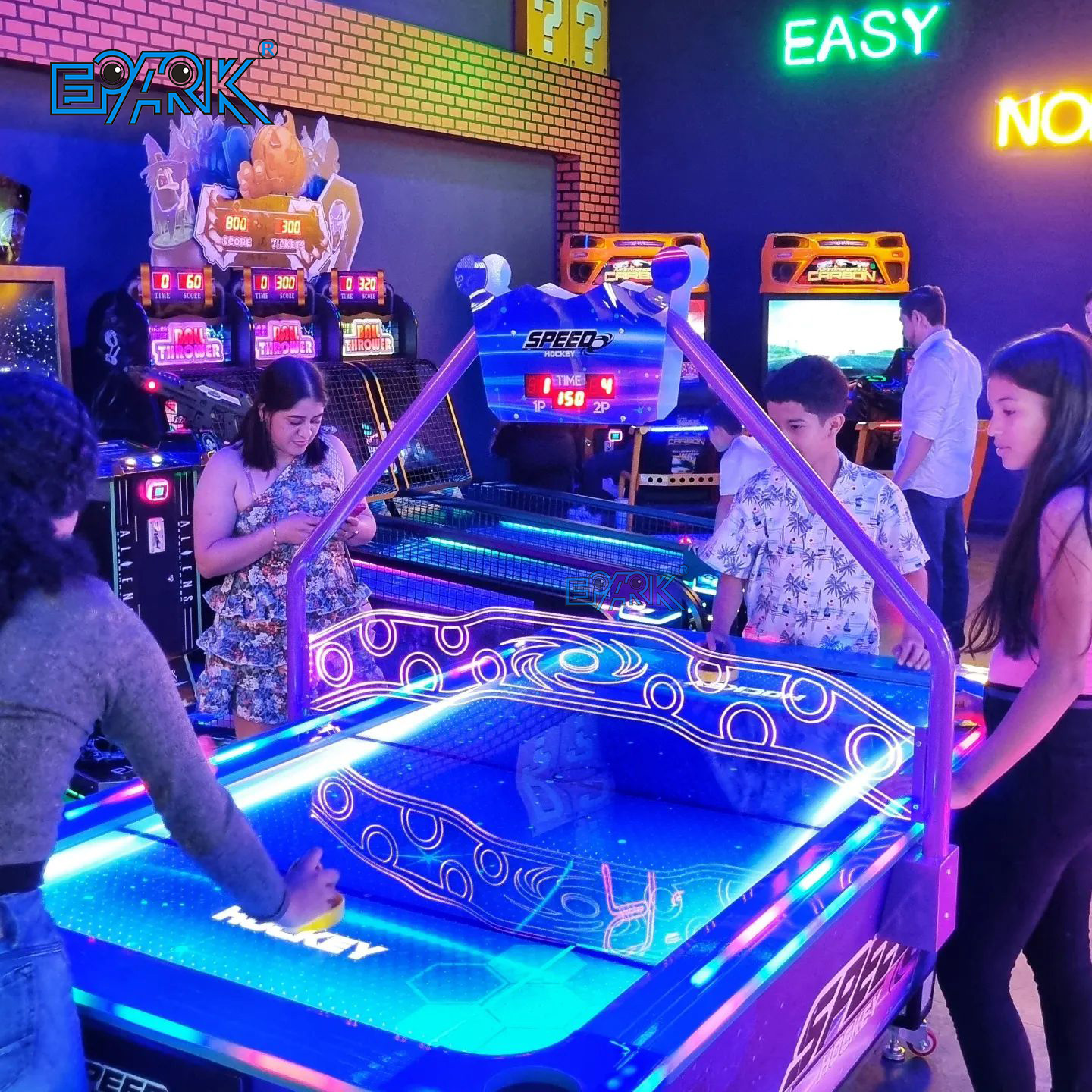 Modern arcade with multiple claw machines and players