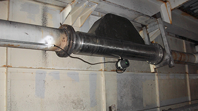Coriolis mass flow meter installed for dirty crude oil measurement with sand, wax and water present