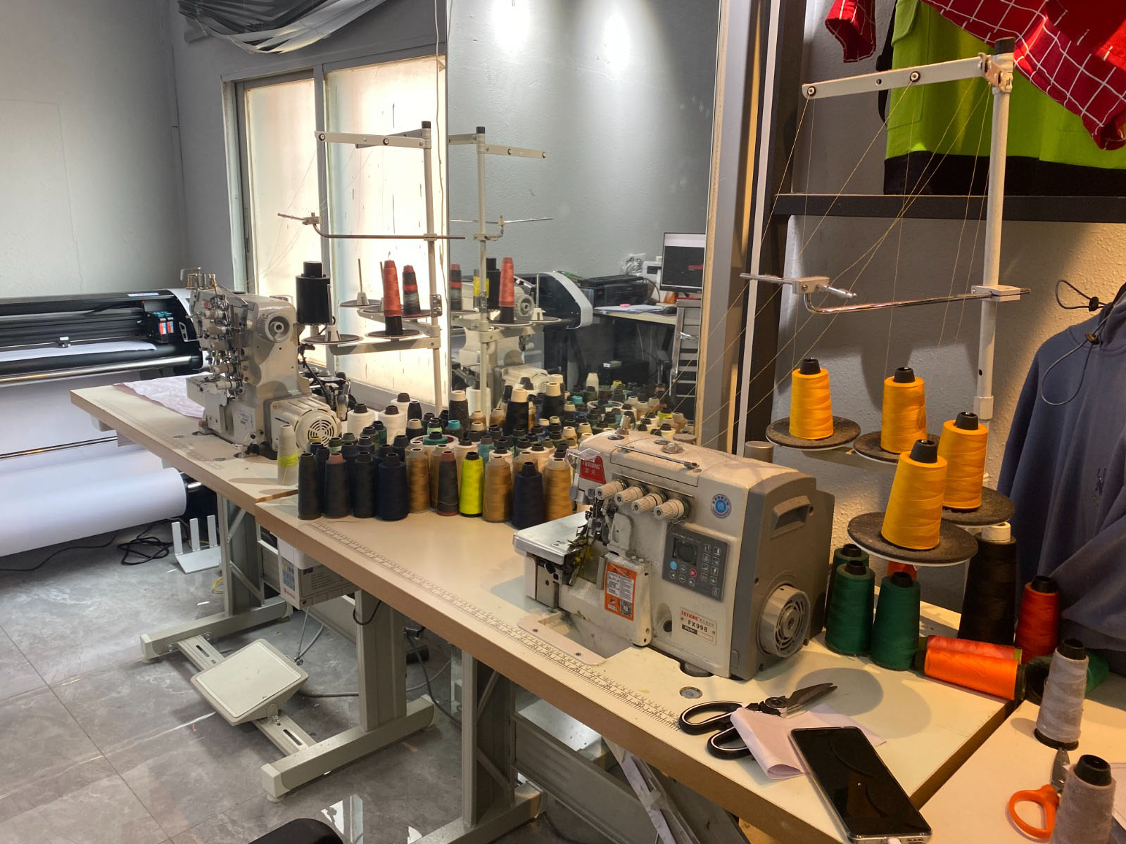 Sewing and cutting bed in a hoodie manufacturing factory