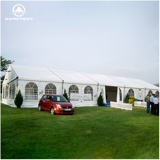 Event tent setup for festival gathering on lawn