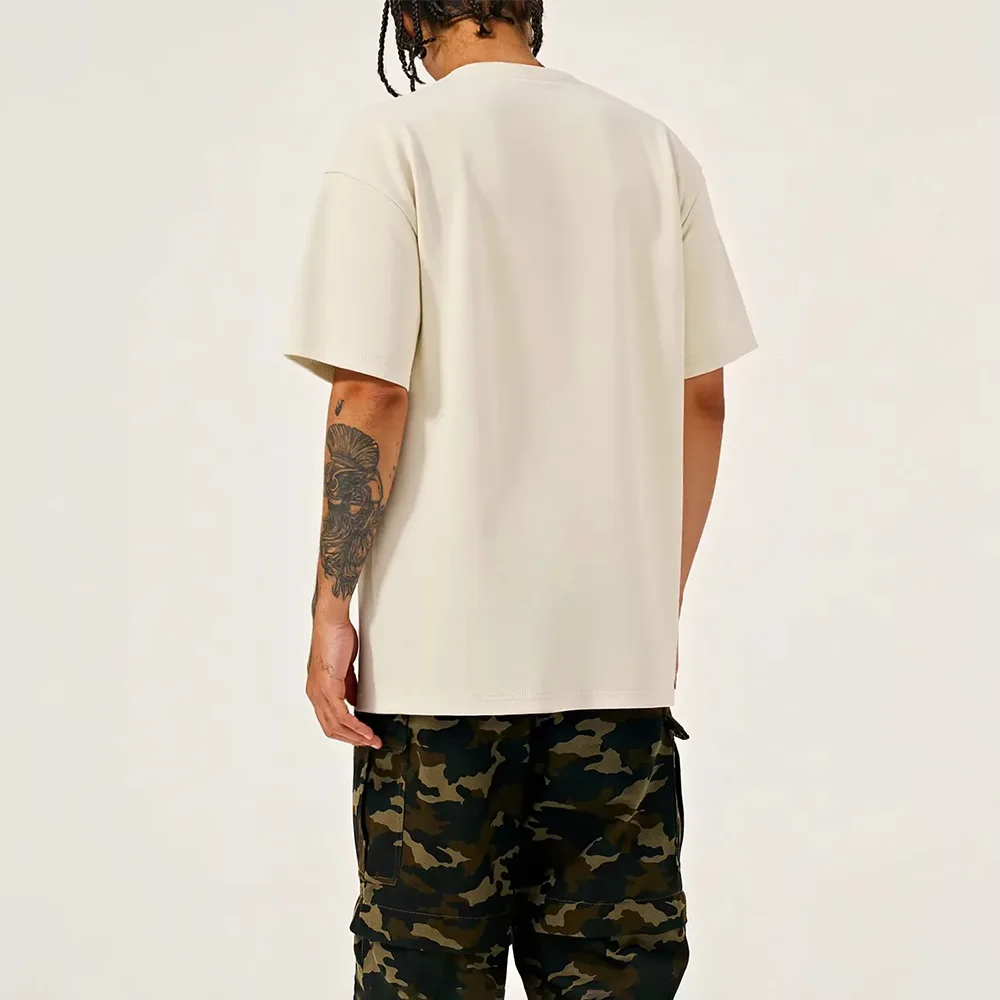 Back view of a custom blank T-shirt showing coverstitch hem finishing and ribbed neckline construction