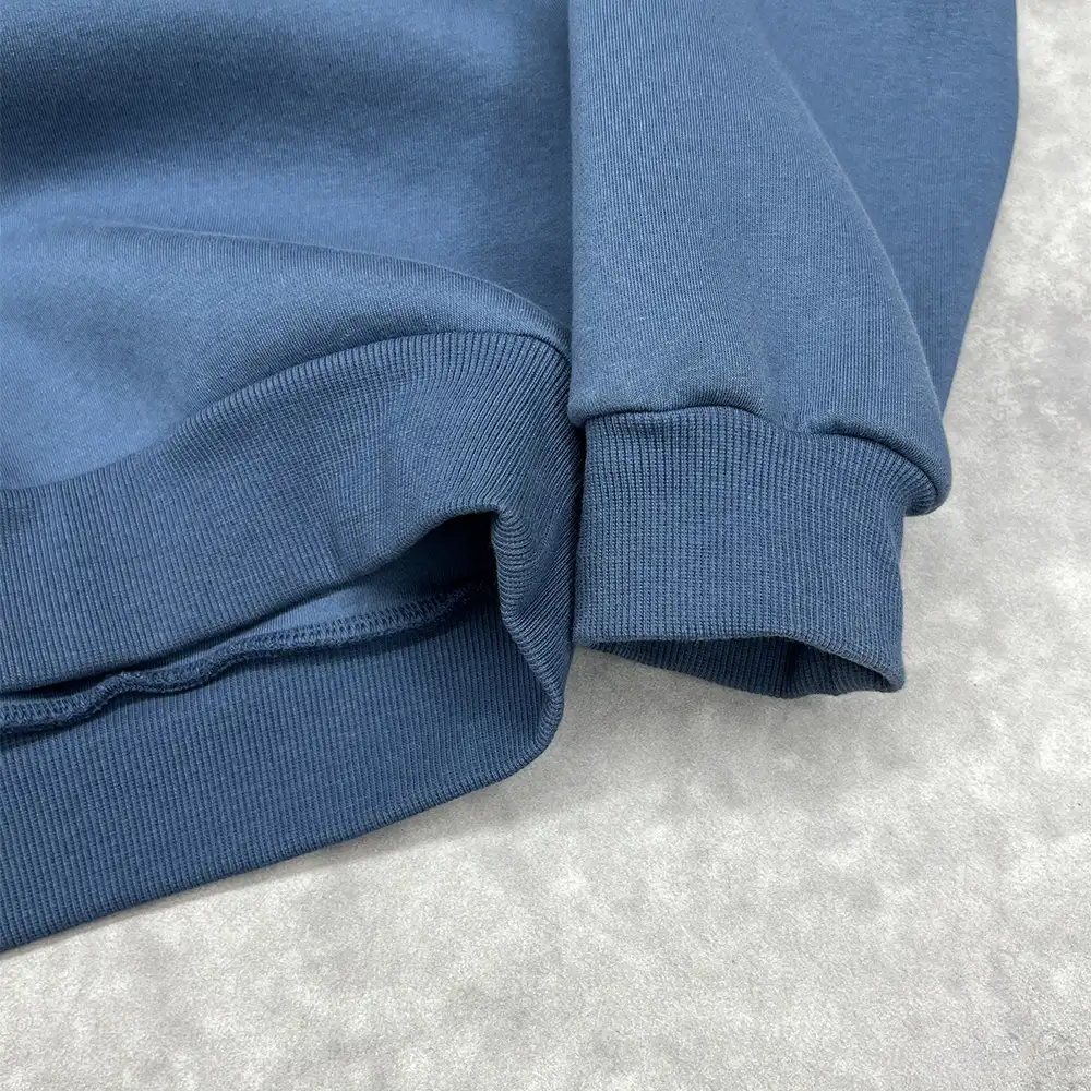 Ribbed cuff detail on a 500 GSM hoodie checked for size-set consistency