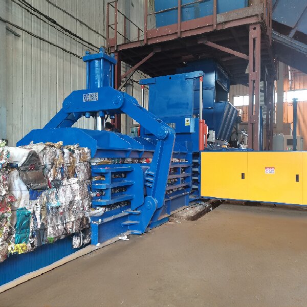 Hydraulic baler installed at a recycling facility