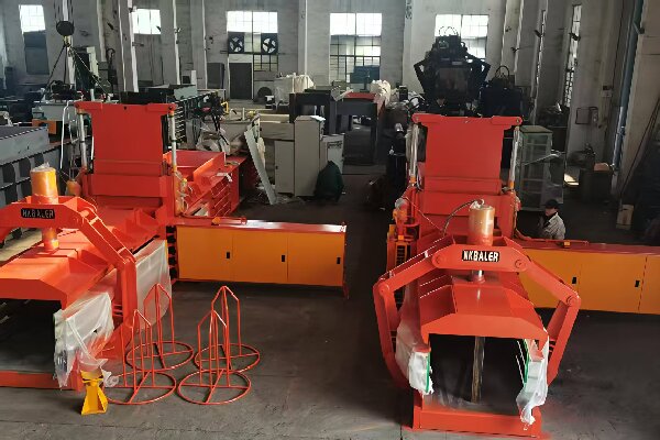 NK BALER hydraulic baler machine in a recycling facility