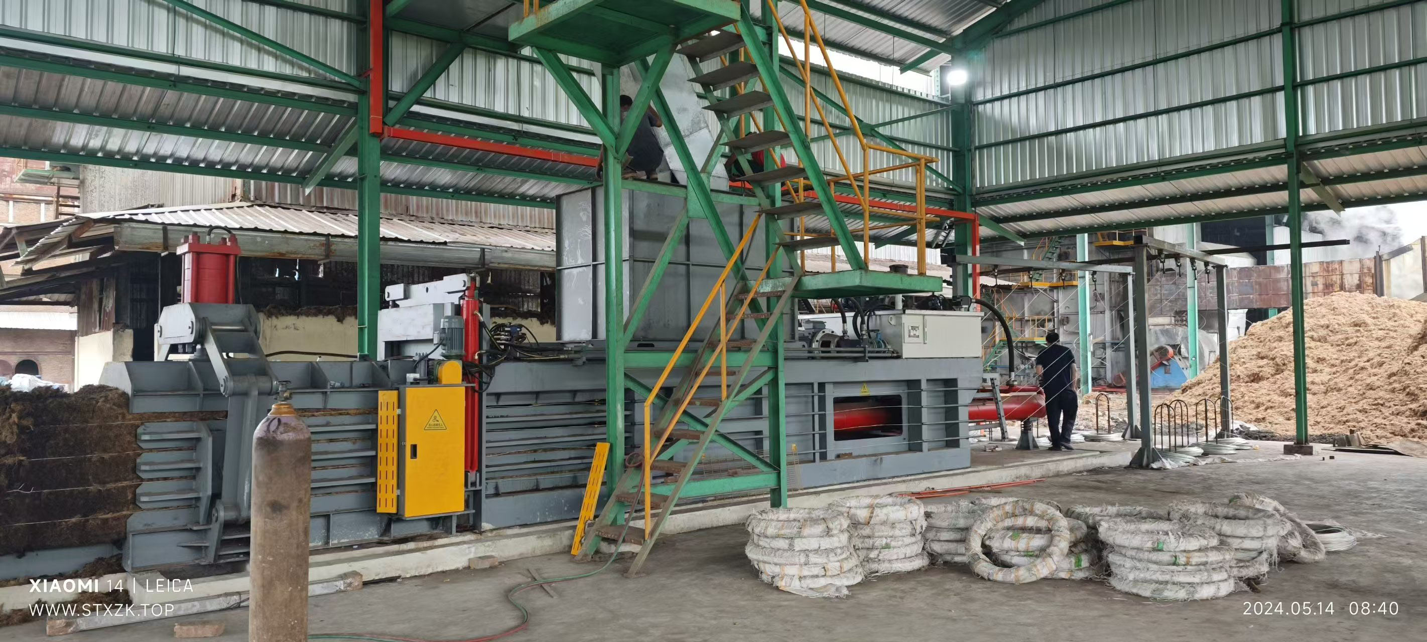 Large Horizontal Hydraulic Baler in an Industrial Setting