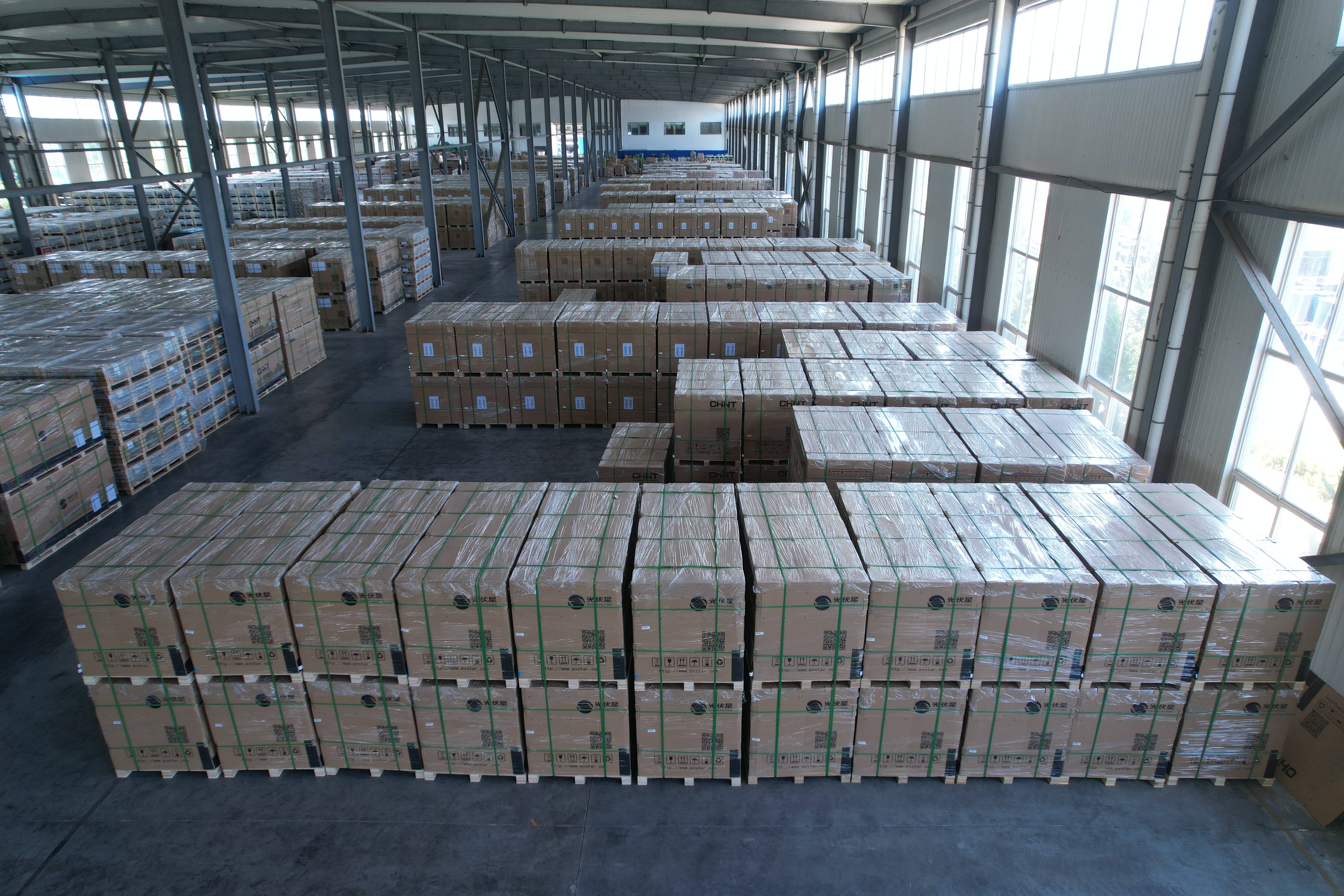 VLAND warehouse with packaged solar energy storage system components ready for shipment