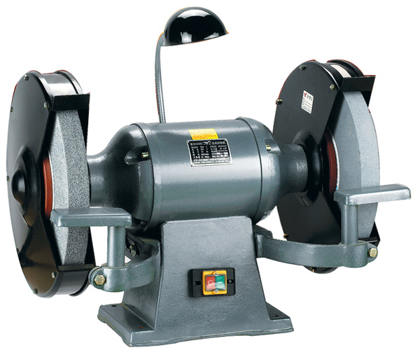 Industrial grinding machine running a vitrified bonded ceramic grinding wheel in a manufacturing workshop