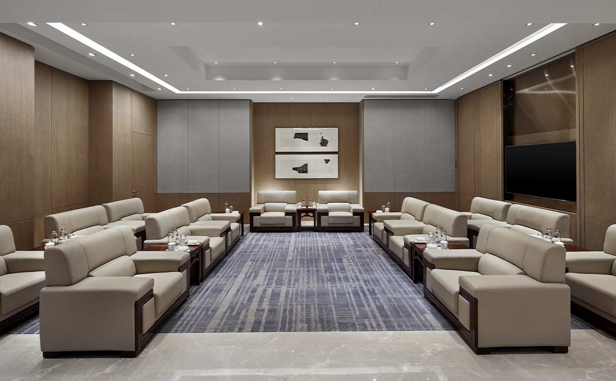 High-end hotel meeting room seating arrangement with custom lounge furniture