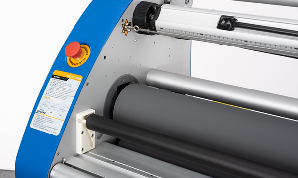 Detail view of an industrial roll laminator control and roller assembly