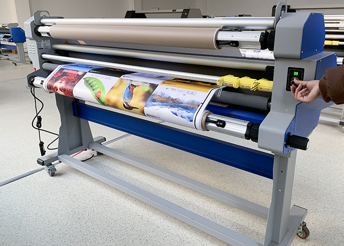 Heat assisted roll laminator being used for large format media lamination