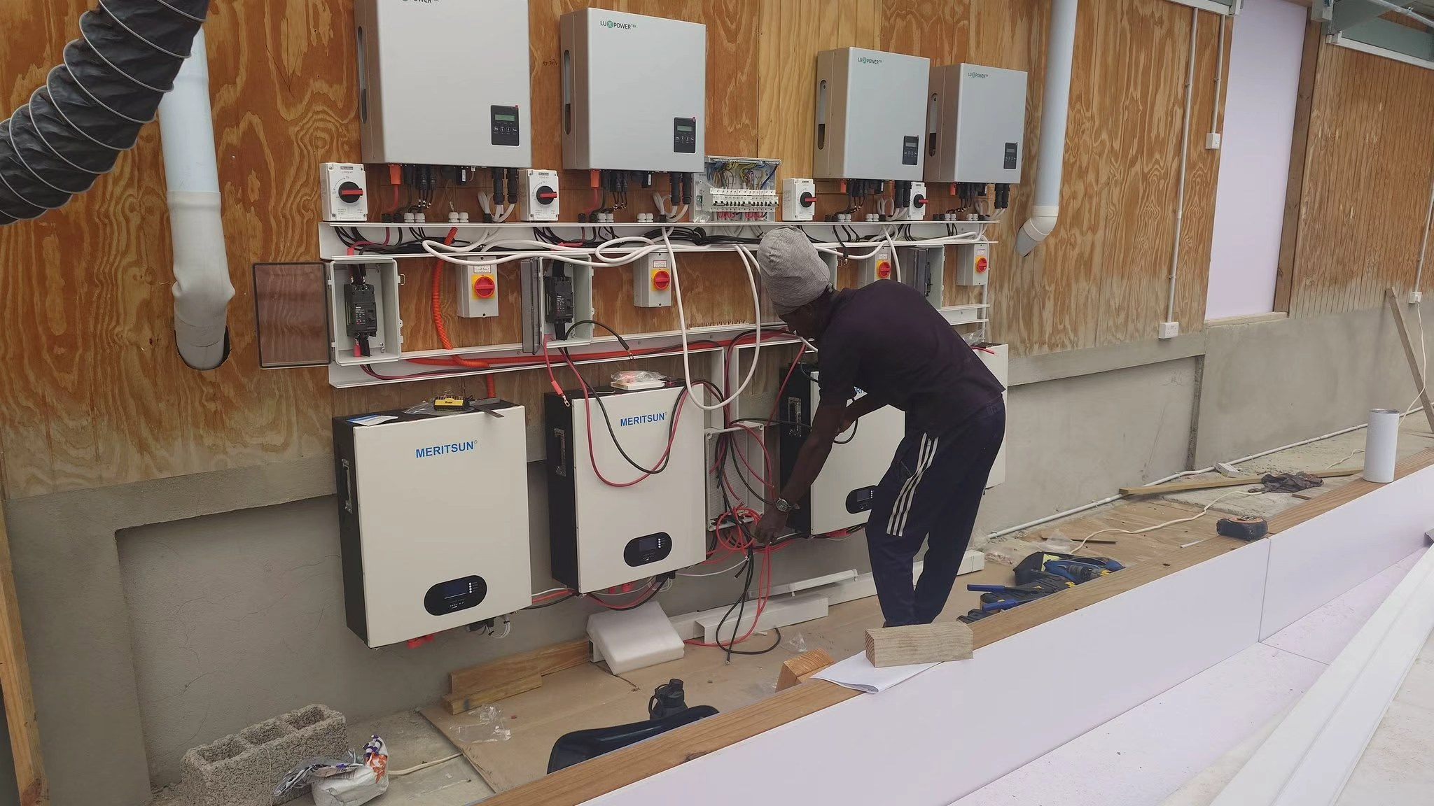 Local installer wiring MERITSUN home battery system in Saint Lucia