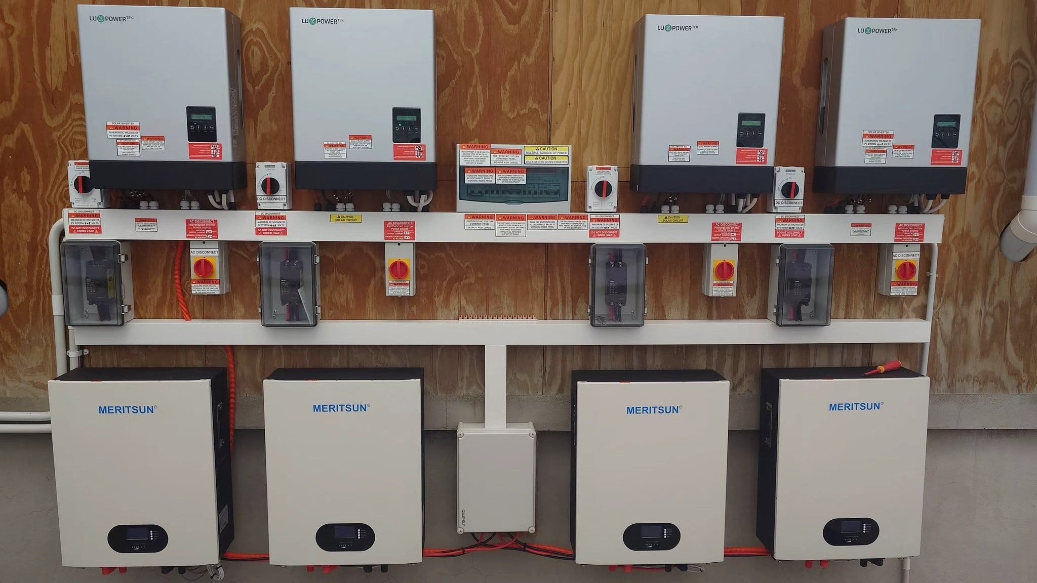 Four MERITSUN 10kWh batteries connected in a residential solar storage system