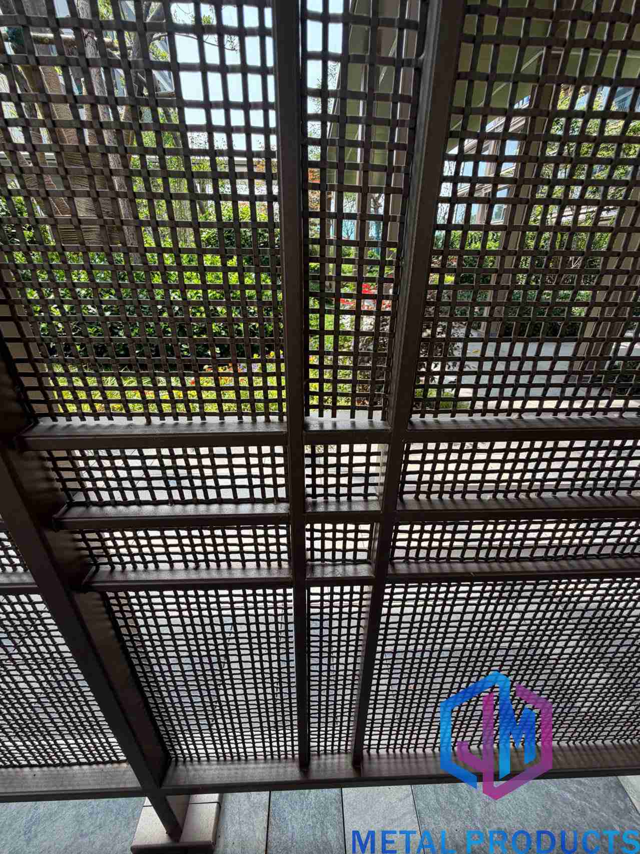 Architectural metal mesh facade screening on a residential courtyard project