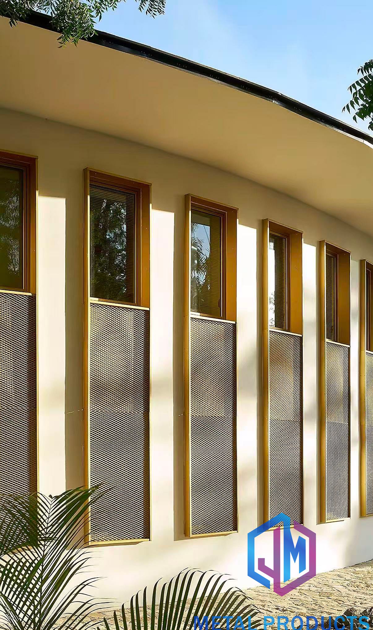 Architectural metal mesh cladding on a resort exterior facade