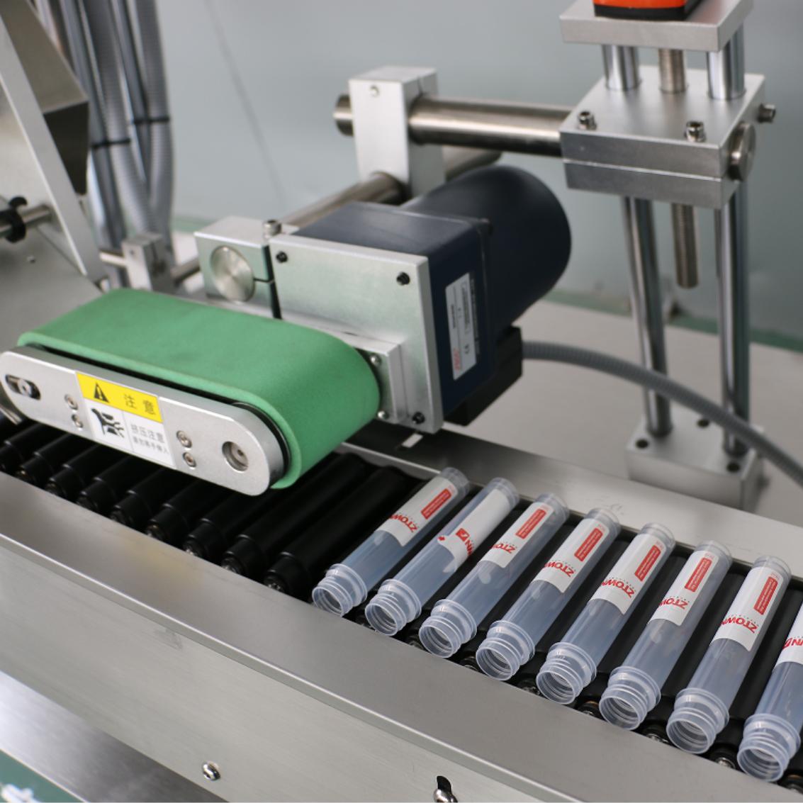 Tube labeling machine labeller