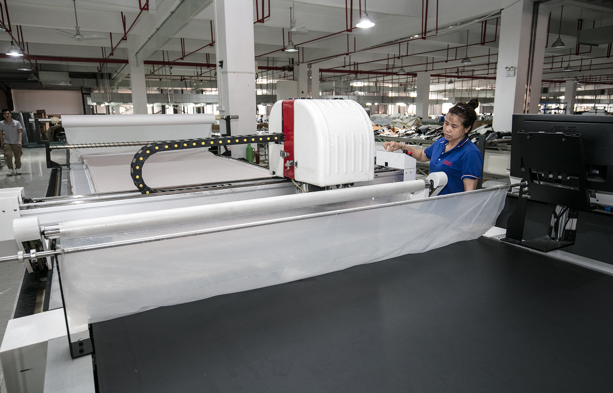 Computerized cutting machine used in 4D massage chair upholstery production