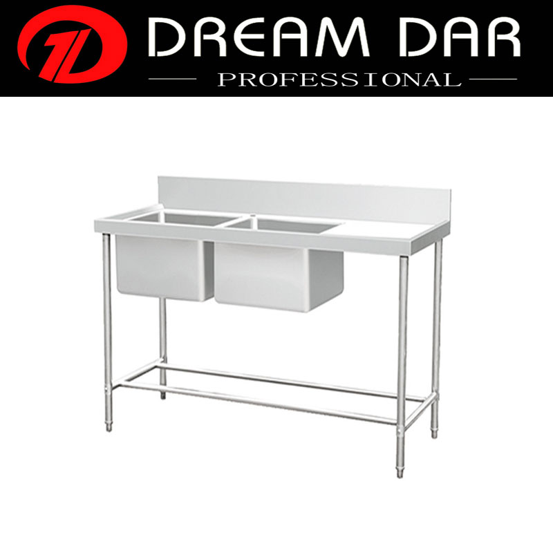 Hotel kitchen used double bowl commercial washing sink with right table and back panel