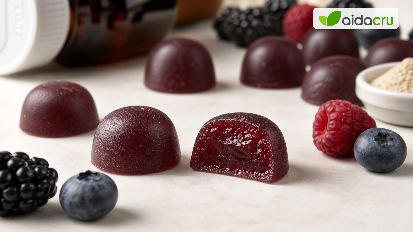 Macro view of Aidacru vegan pectin berry gummies showing surface texture, elasticity and cut-section consistency