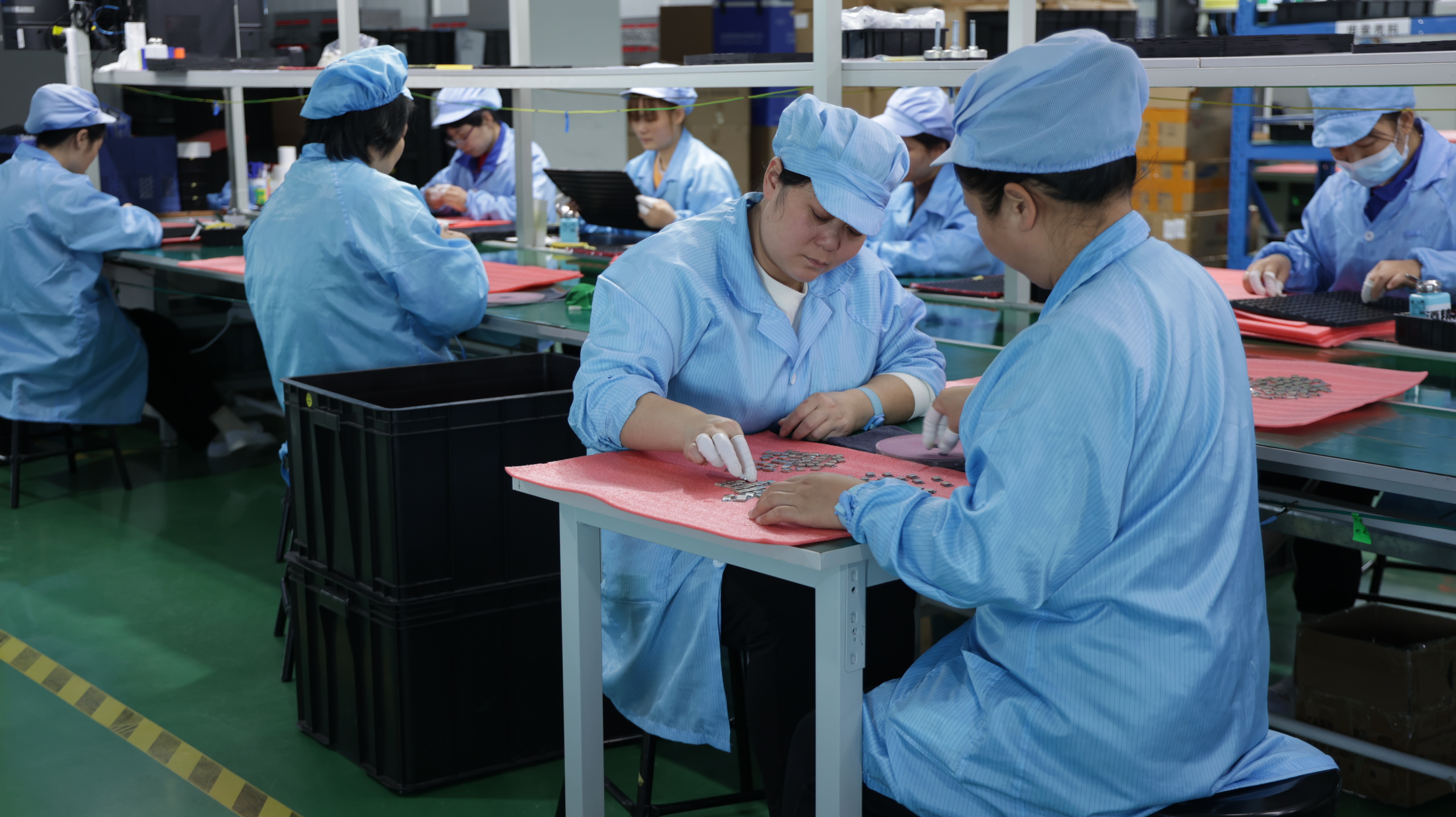 Modern hearing aid assembly line at Flysound facility