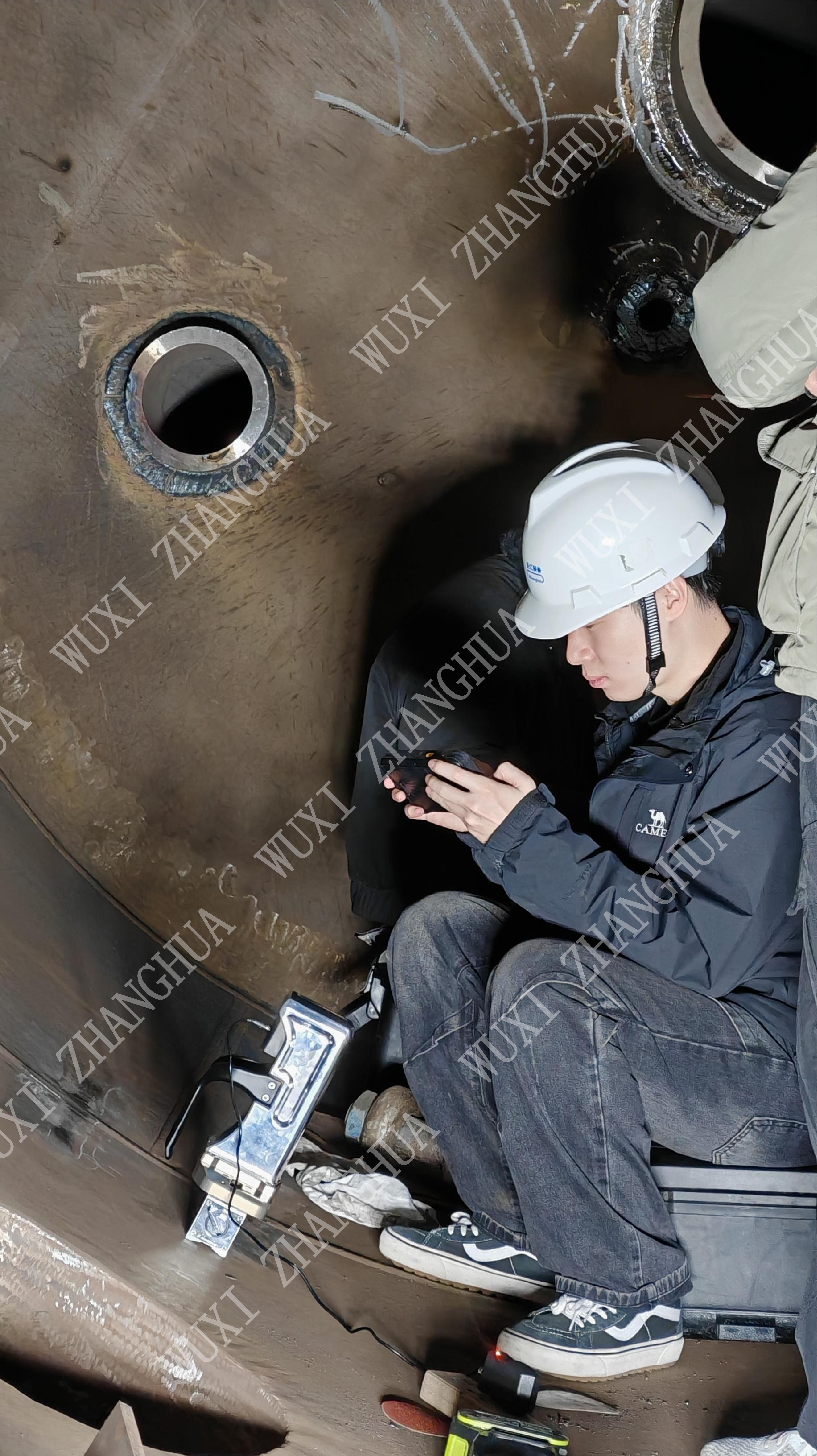 Operator safely using Non-Destructive Weld Stress Tester without radiation risk