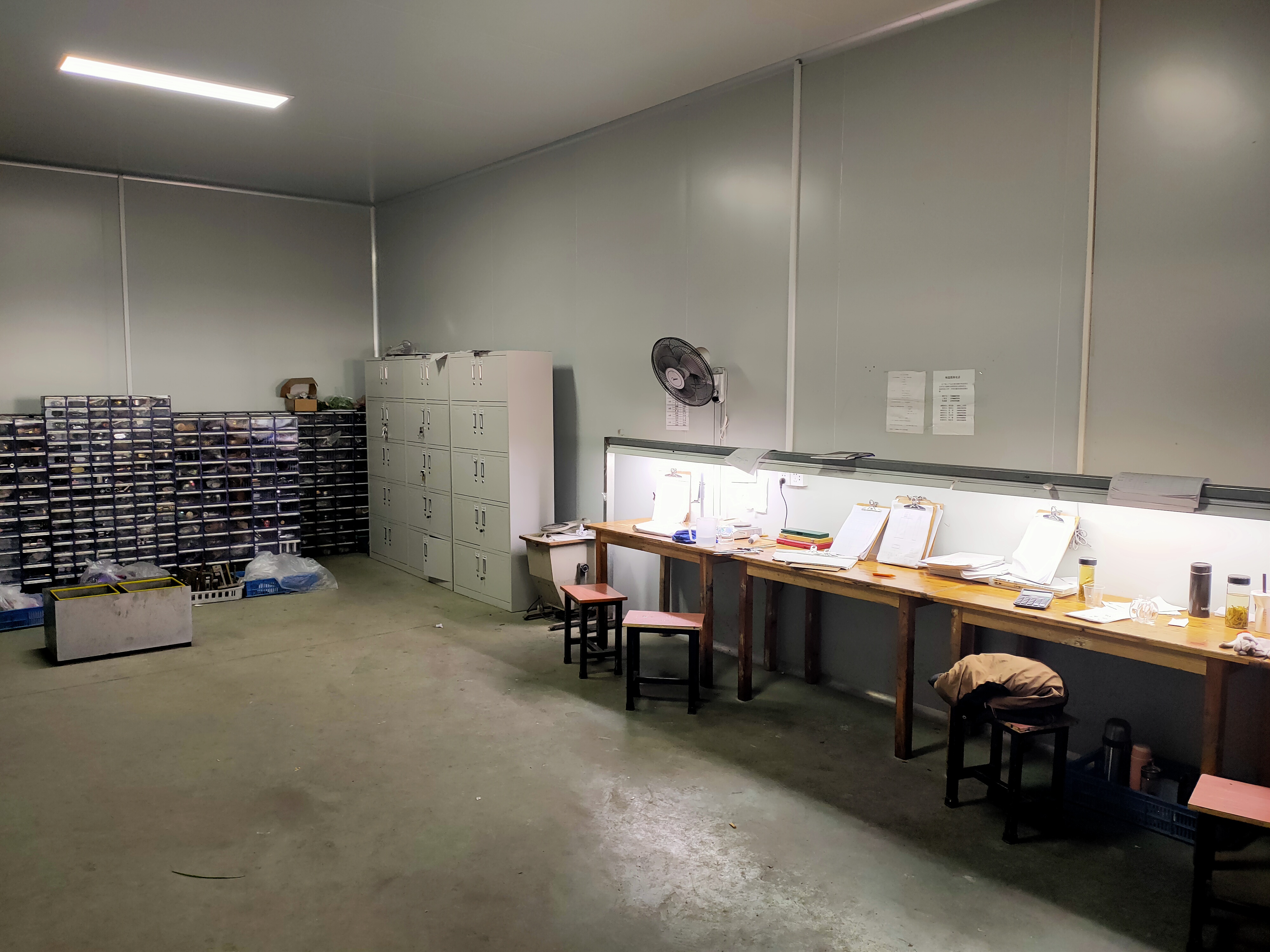 Workshop scene showing packaging assembly and quality control at Honor