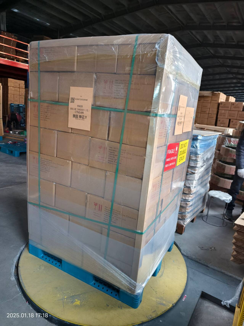 Fragile glass packaging wrapped with protective foam and loaded on pallets