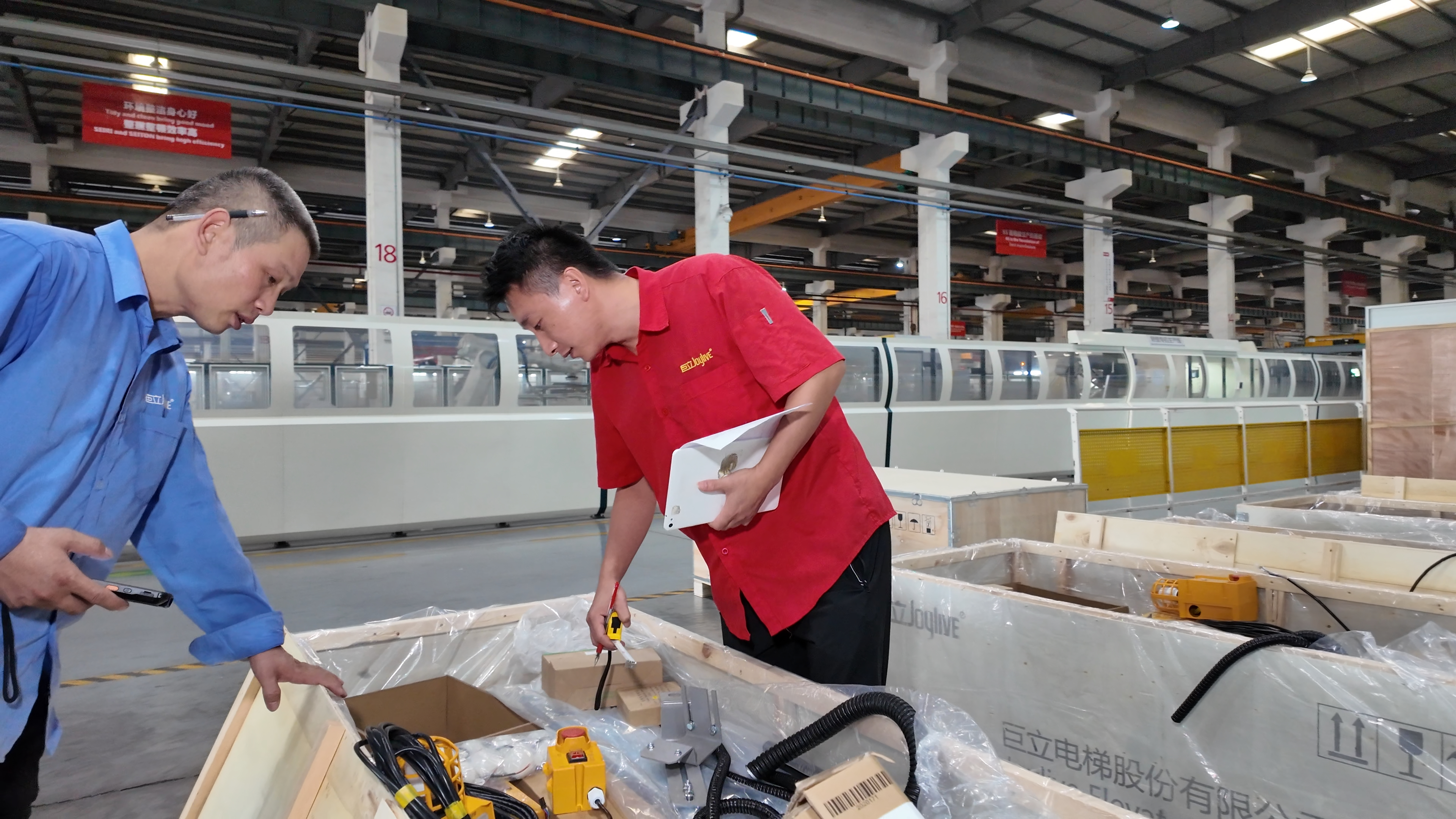 Final inspection before shipment of industrial elevator equipment