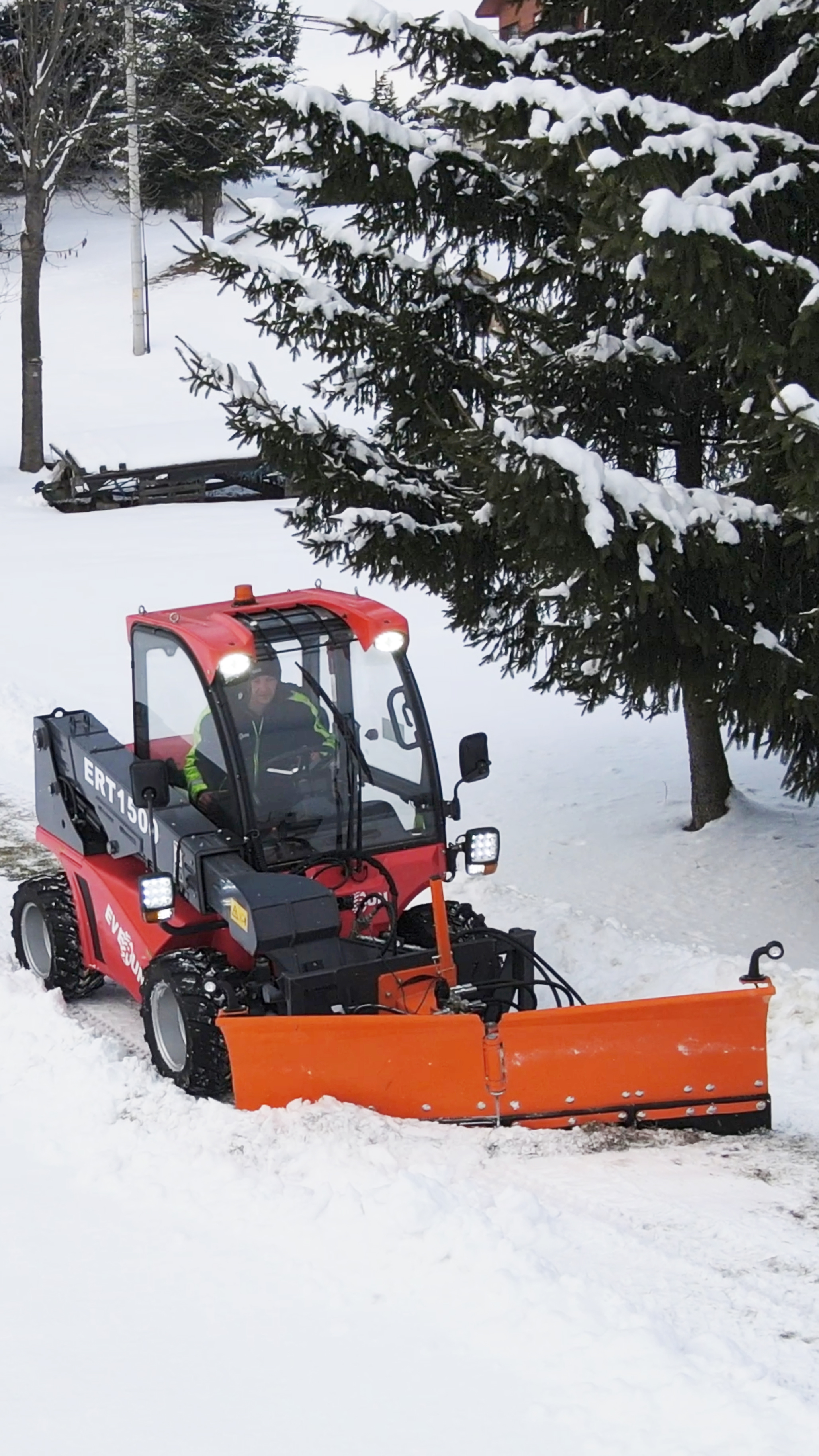 Mini wheel loader working in snow removal application for agriculture and construction