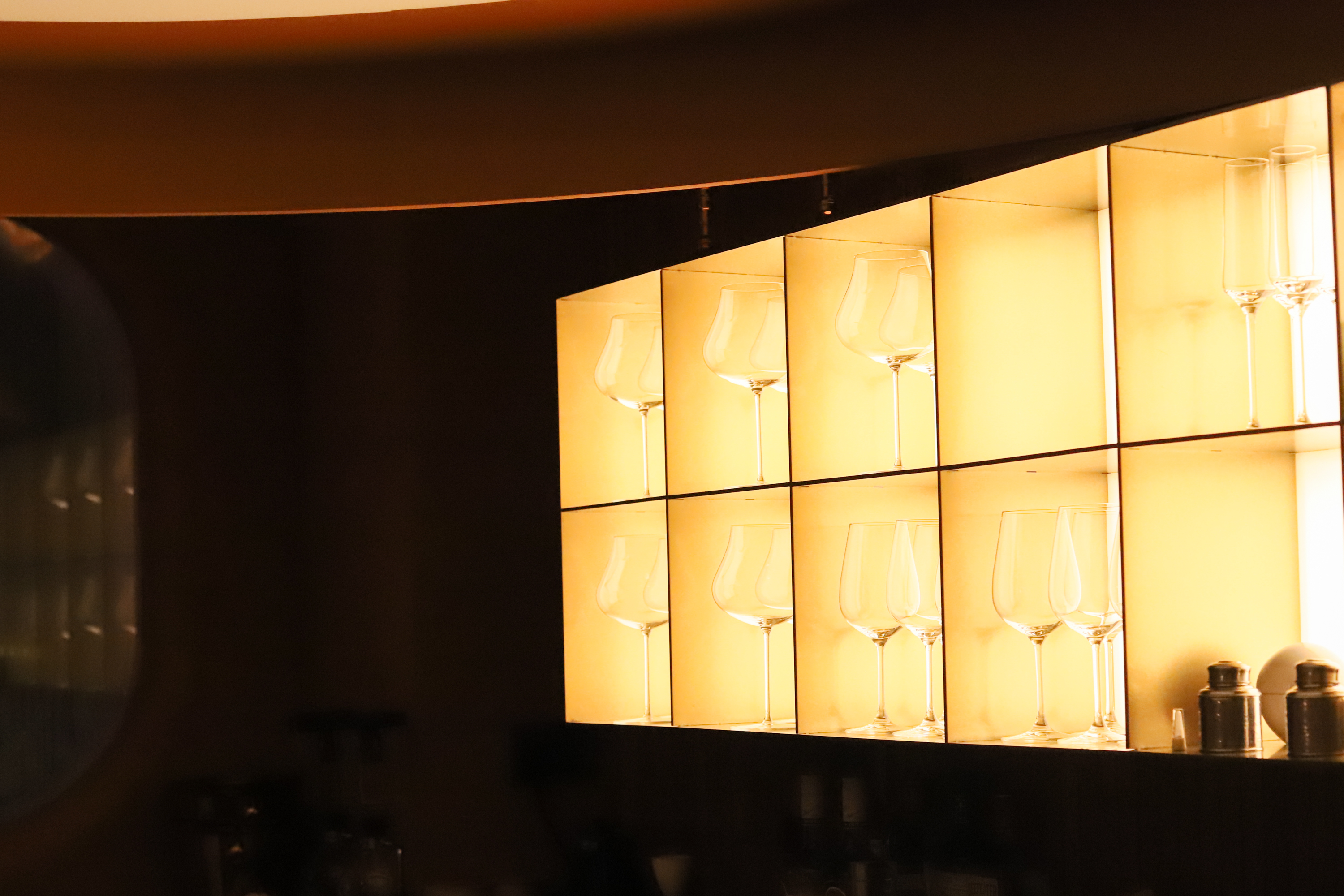 Upper floor crafted bar space at a Central wellness hub, evening daypart
