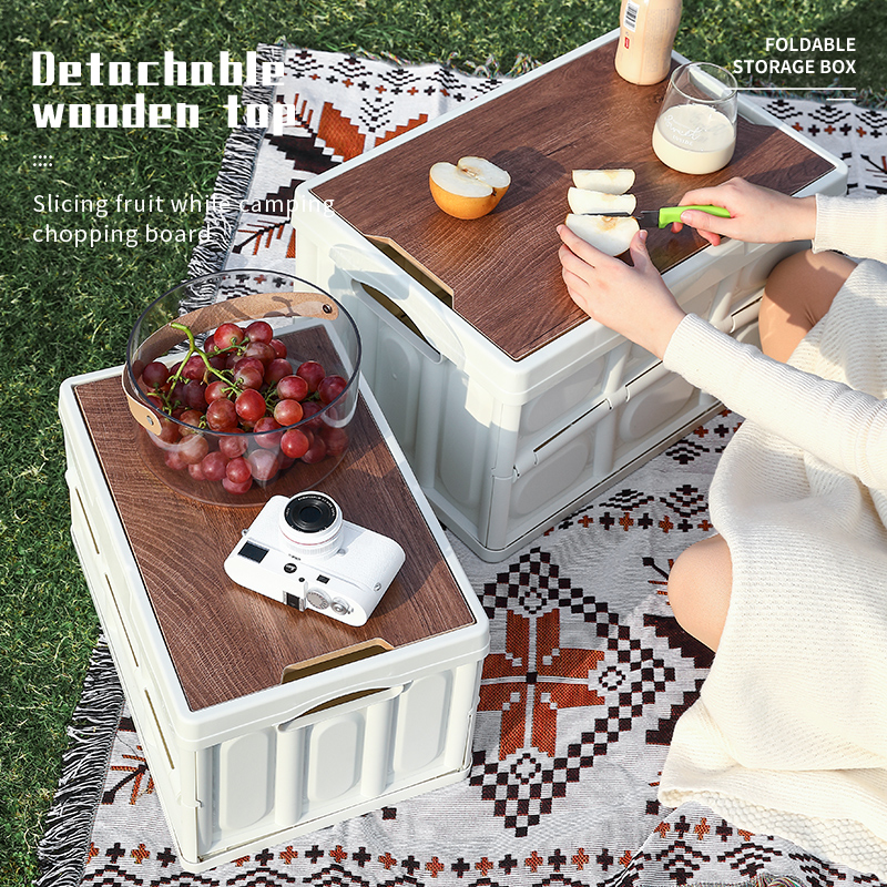 Detachable wooden top works as a cutting board for picnic fruit preparation.