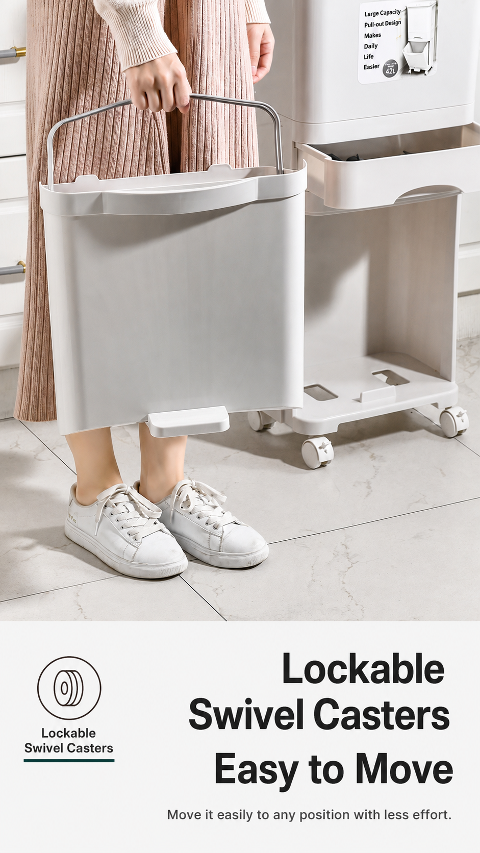 This kitchen trash bin has a dual-function handle that can be used for carrying or for hanging bags.