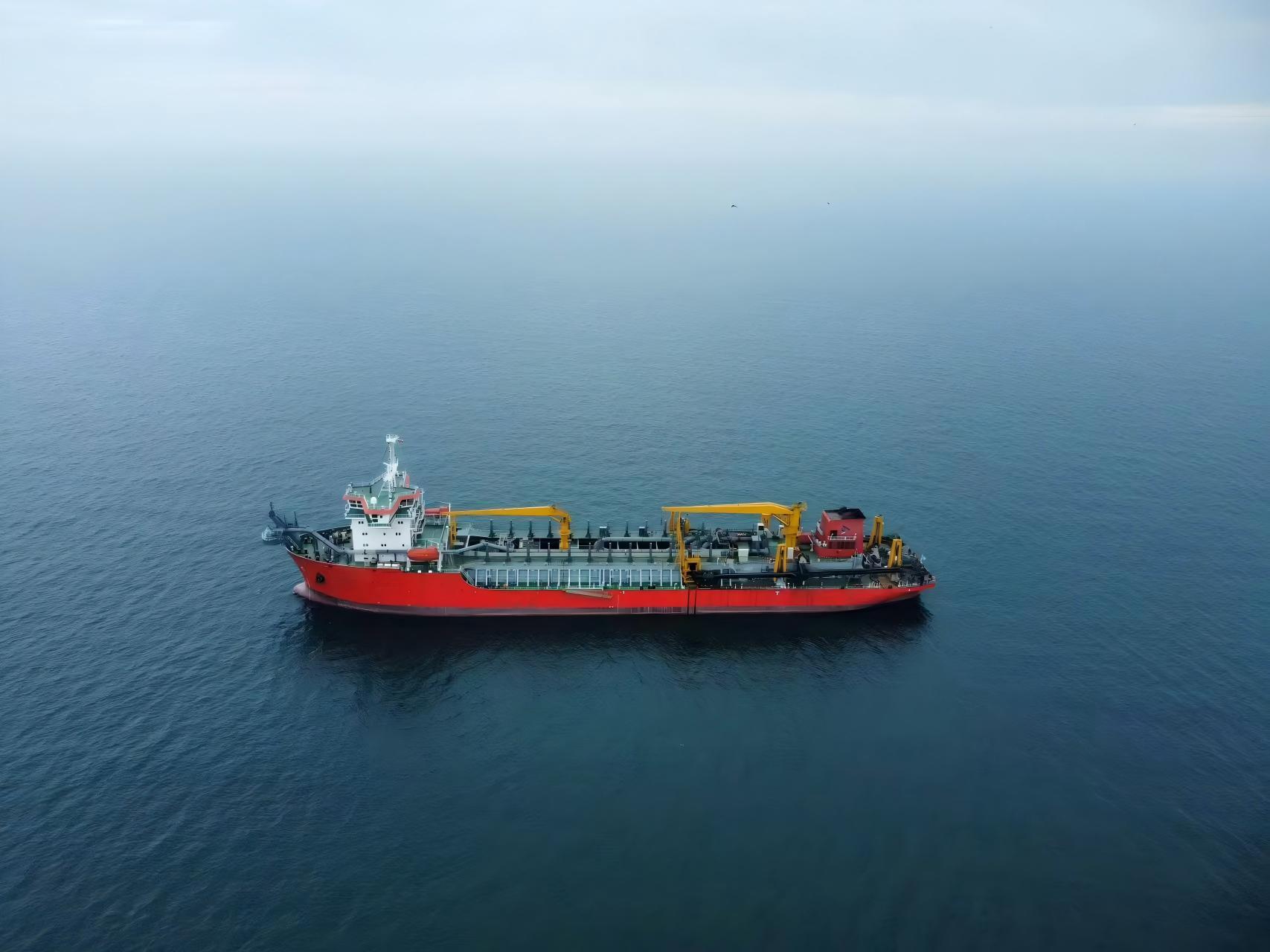 Large trailing suction hopper dredger at sea, illustrating project-scale dredging equipment for port and offshore projects