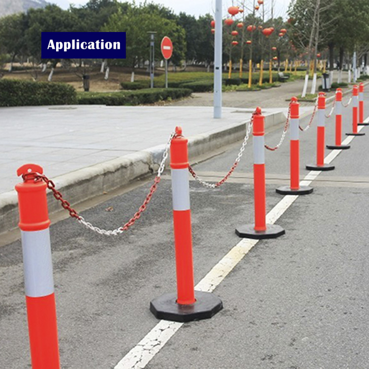 High-visibility warning post deployed on a road for traffic delineation