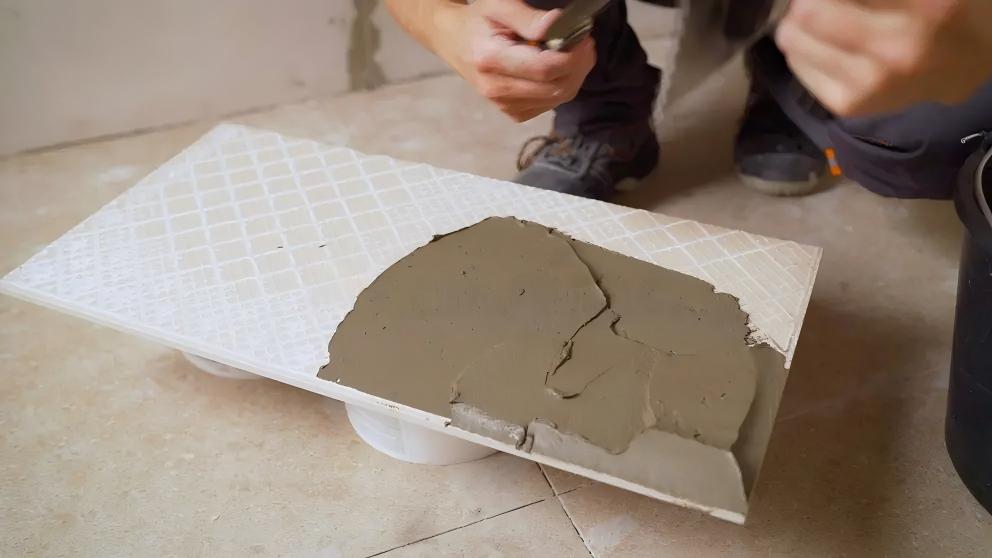 Tile adhesive application in a construction project