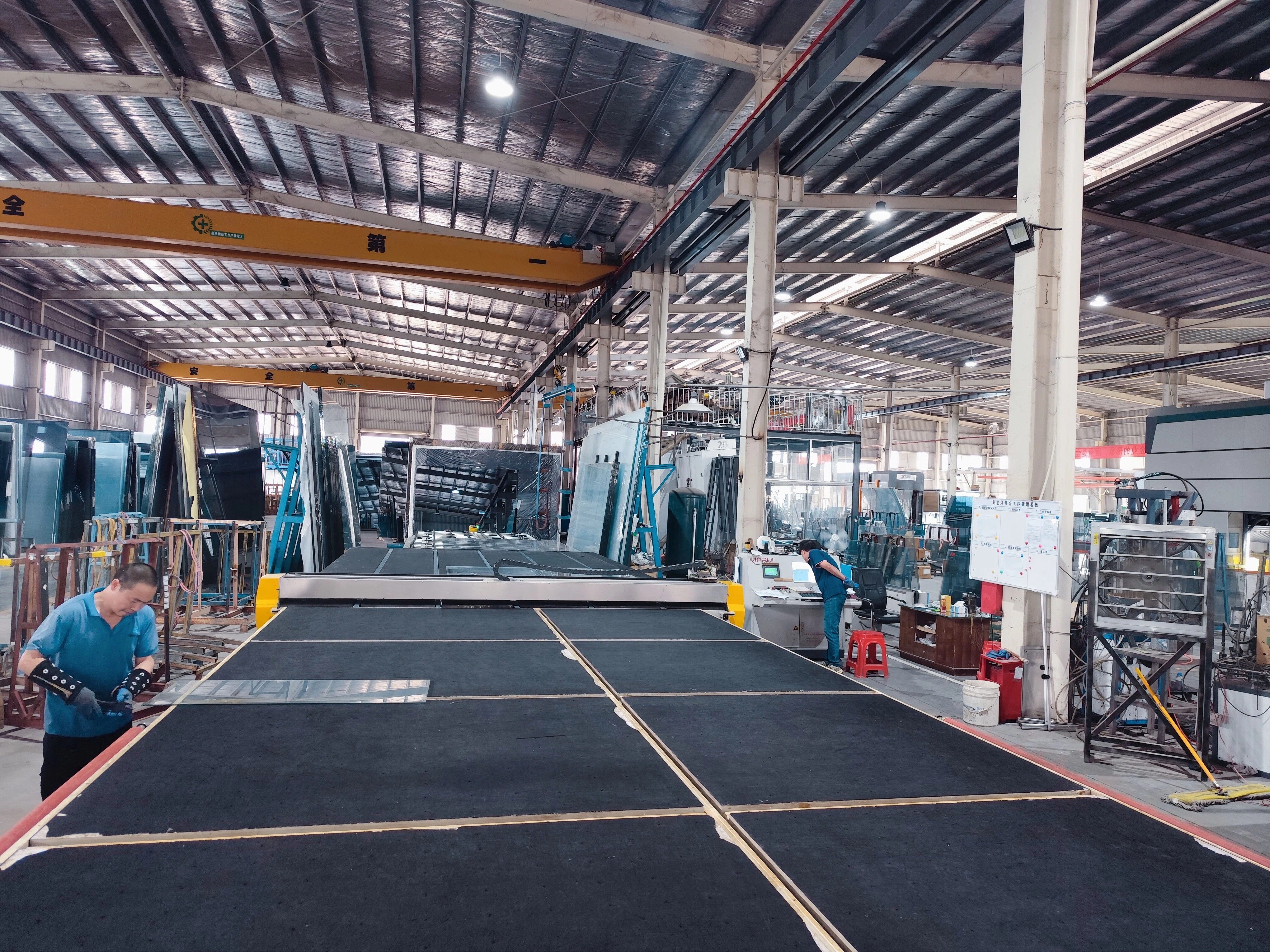 CNC cutting line at DYGLASS factory for precise glass dimensioning
