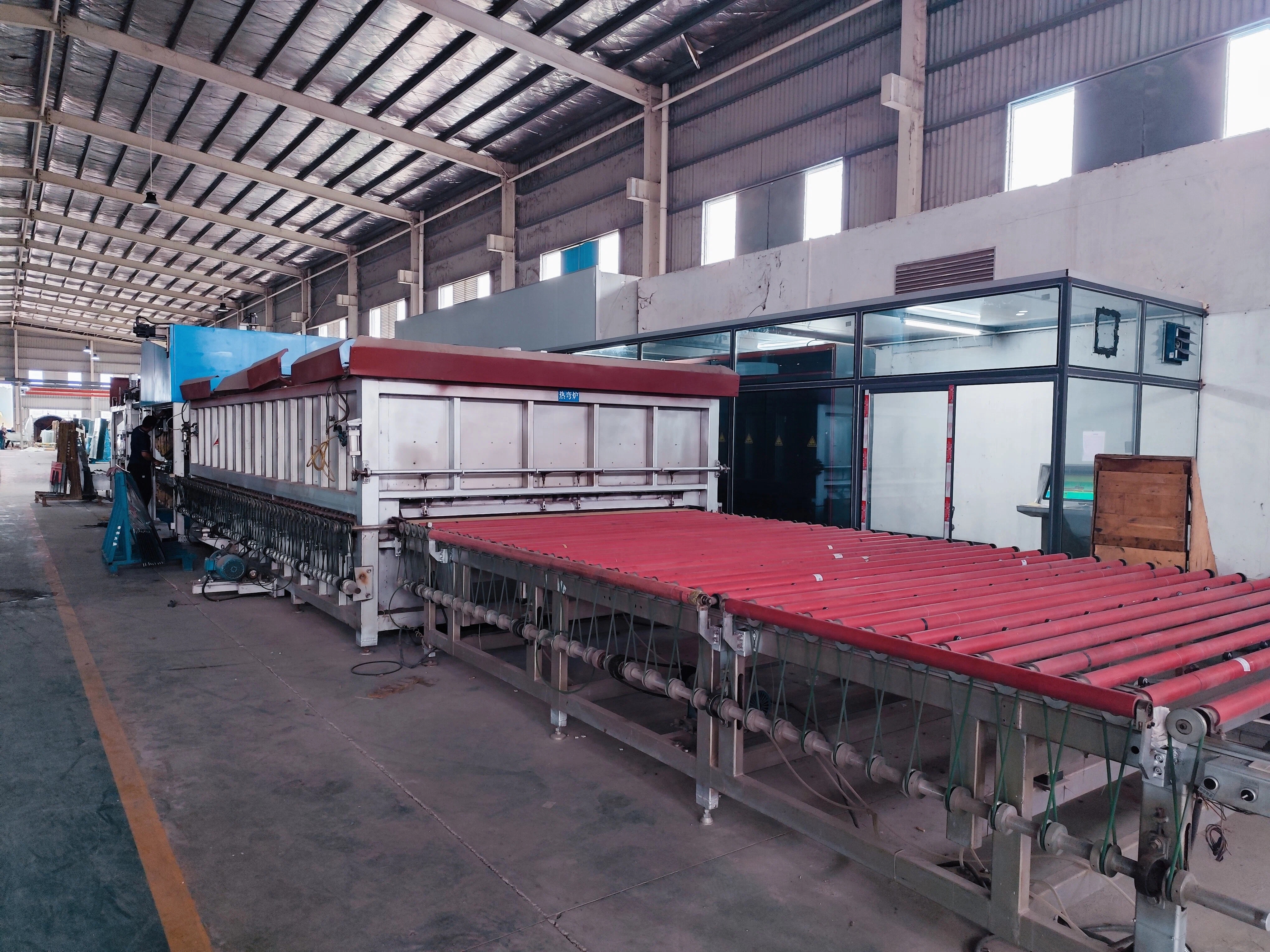 Double curved tempering line at DYGLASS factory showing advanced production capability